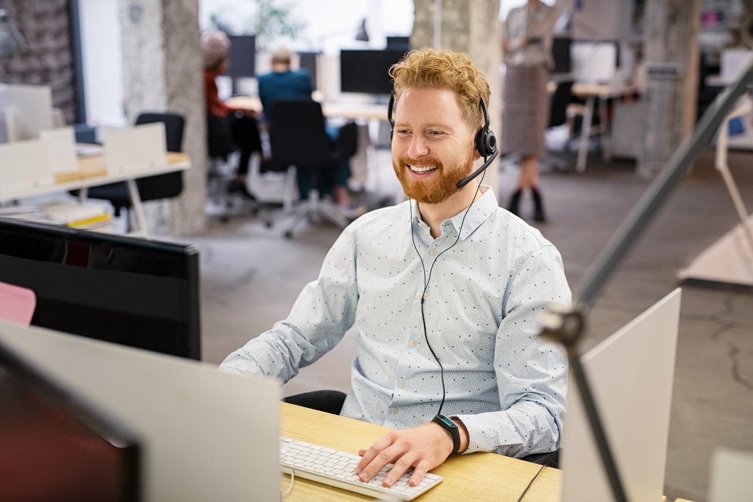 Happy man talking over phone